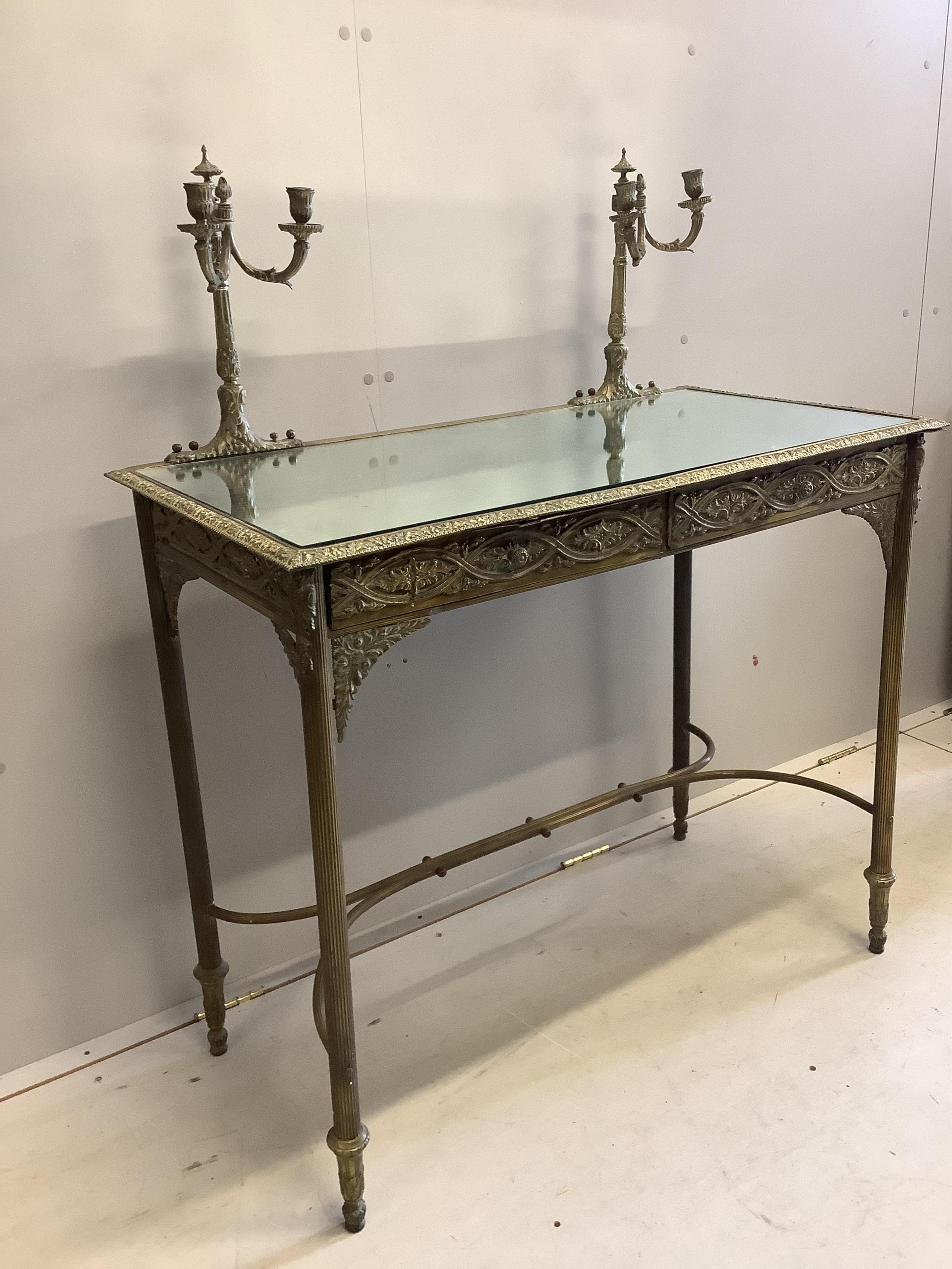 A brass and mirrored console table, width 96cm, depth 48cm, height 118cm. Condition - fair